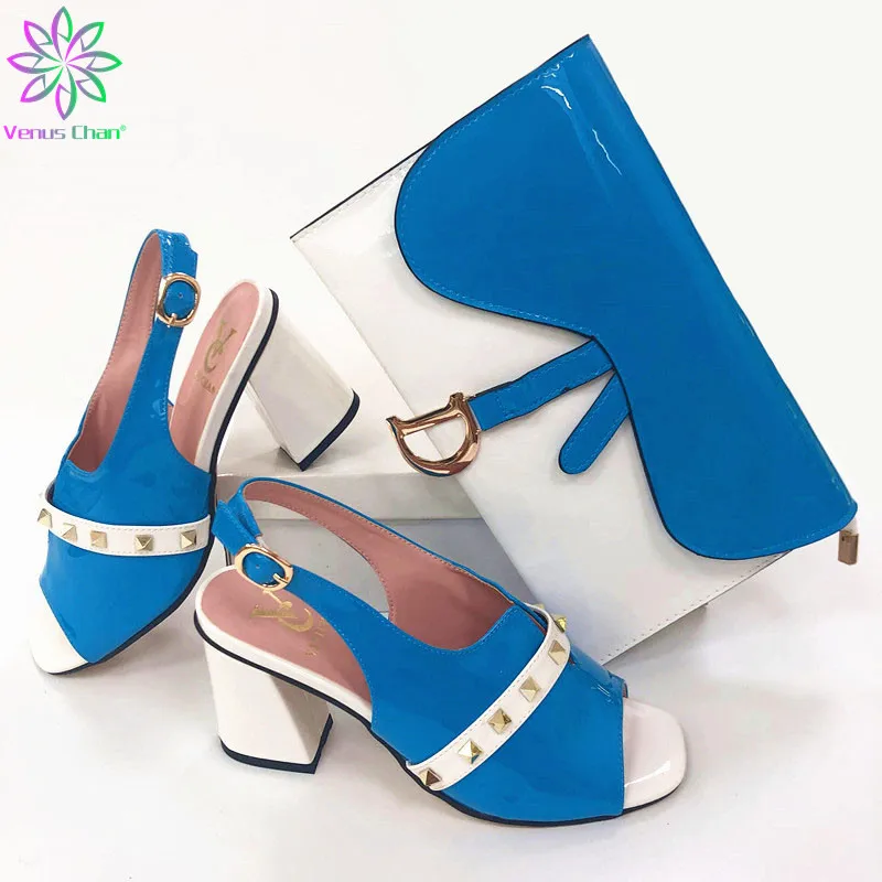 Туфли с сумкой в комплекте для свадебной вечеринки, новые модные женские туфли-лодочки и сумки в нигерийском стиле
Туфли с сумкой в комплекте для свадебной вечеринки, новые модные женские туфли-лодочки и сумки в нигерийском стиле