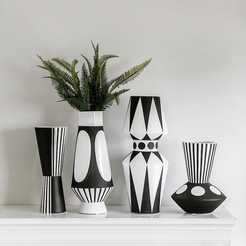Nordic creative black and white ceramic vase abstract style flower arrangement flower retro classic home craft ornament
Nordic creative black and white ceramic vase abstract style flower arrangement flower retro classic home craft ornament