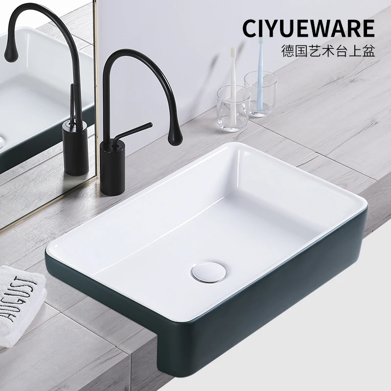 Nordic semi-embedded washbasin semi-thrown narrow dark green above counter washbasin ceramic semi-inlaid washbasin
Nordic semi-embedded washbasin semi-thrown narrow dark green above counter washbasin ceramic semi-inlaid washbasin