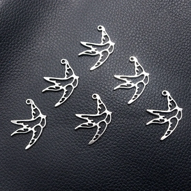 12pcs/lot Silver Plated Hollow Swallow Charm Metal Pendants DIY Necklaces Bracelets Jewelry Handicraft Accessories 35*22mm P450 
12pcs/lot Silver Plated Hollow Swallow Charm Metal Pendants DIY Necklaces Bracelets Jewelry Handicraft Accessories 35*22mm P450