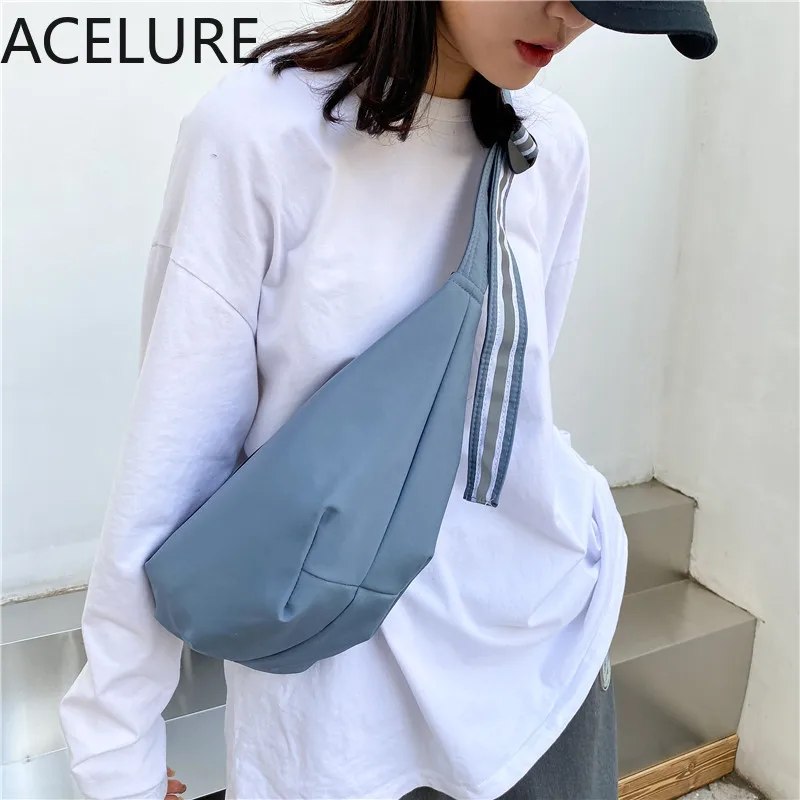 ACELURE Solid Color Reflective Strap Jumper Bags New Dumpling Bag Female Fashion Student Harajuku Style Shoulder Cross Body Bag
ACELURE Solid Color Reflective Strap Jumper Bags New Dumpling Bag Female Fashion Student Harajuku Style Shoulder Cross Body Bag