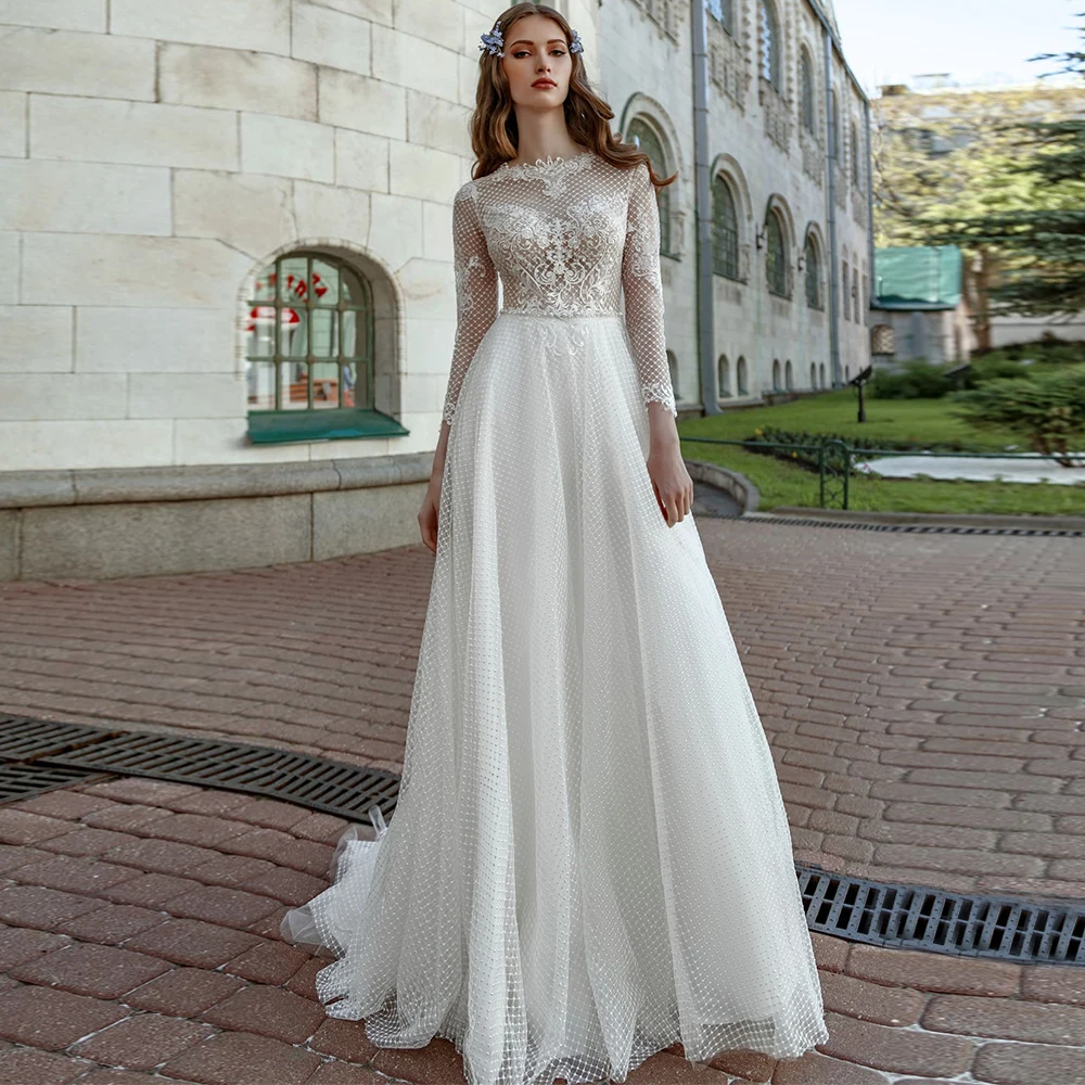 Elegant Wedding Dresses Netting Appliques Bateau Boho Long Sleeve Sweep Train Pearls Floor Length A-Line Button Bridal Gowns
Elegant Wedding Dresses Netting Appliques Bateau Boho Long Sleeve Sweep Train Pearls Floor Length A-Line Button Bridal Gowns