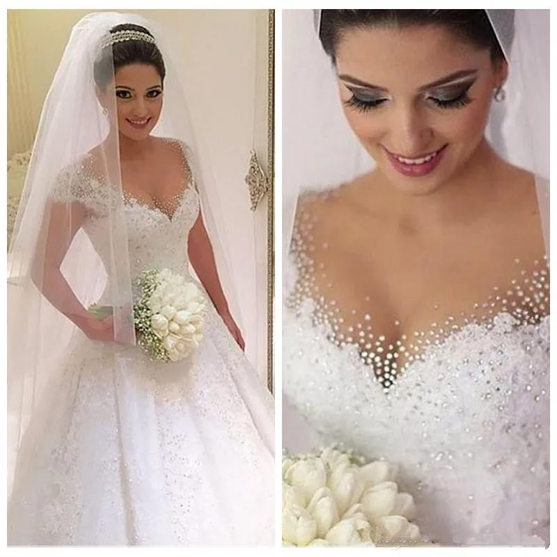 2021 Sheer Short Sleeves Lace Appliques A-Line Wedding Dresses Beaded Bridal Gowns plus size Vestidos De Marriage Middle East
2021 Sheer Short Sleeves Lace Appliques A-Line Wedding Dresses Beaded Bridal Gowns plus size Vestidos De Marriage Middle East