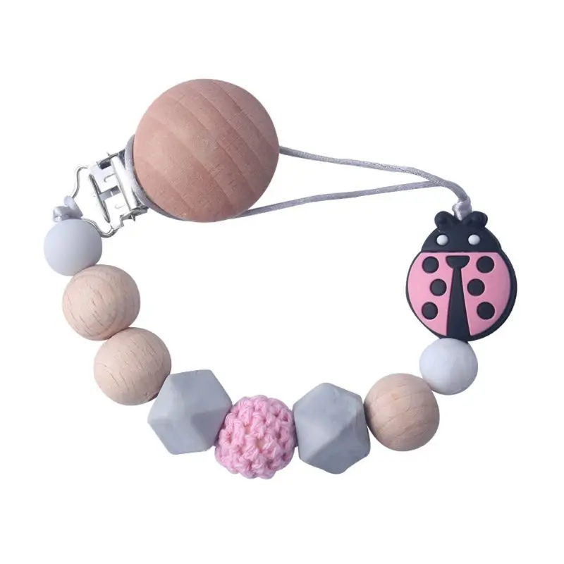 Silicone Pacifier Clip Wooden Bead Dummy Clip Holder Cute Ladybug Beads Pacifier Clips Soother Chains Baby Teething Toy AXYA
Silicone Pacifier Clip Wooden Bead Dummy Clip Holder Cute Ladybug Beads Pacifier Clips Soother Chains Baby Teething Toy AXYA