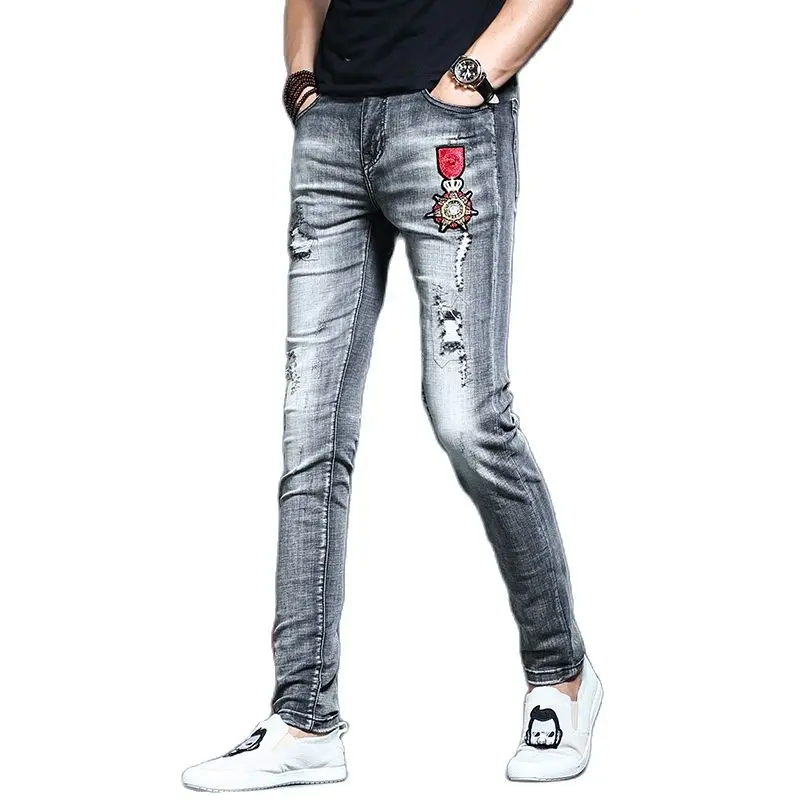 Men's Distressed Ripped Hole Embroidery Medal Jeans Pants Slim Fit Brand Luxury Korean Casual Teenager Grey Cowboys Long Pants
Men's Distressed Ripped Hole Embroidery Medal Jeans Pants Slim Fit Brand Luxury Korean Casual Teenager Grey Cowboys Long Pants
