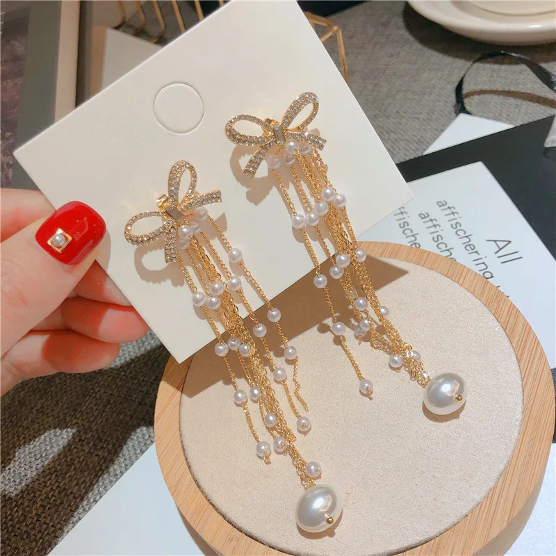 2021 New S925 Silver Needle Bowknot Tassel Long Pearl Stud Earrings for Women Fashion Trend Temperament Female Earrings 
2021 New S925 Silver Needle Bowknot Tassel Long Pearl Stud Earrings for Women Fashion Trend Temperament Female Earrings