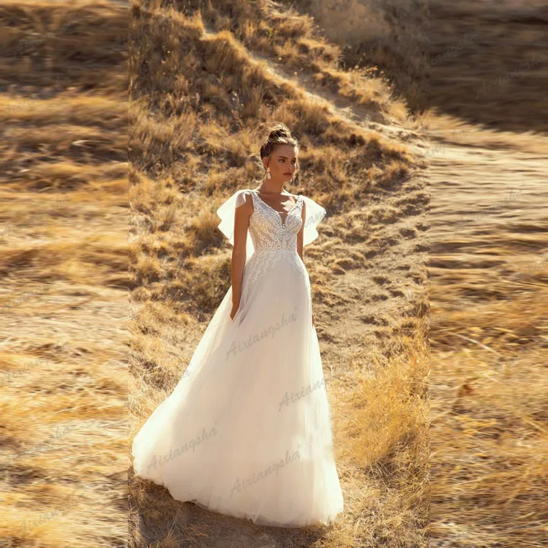 Bohemian Wedding Dresses V Neck Appliques Lace A-Line Tulle White Ivory Simple Boho Bride Gown 2021 vestidos de novia 
Bohemian Wedding Dresses V Neck Appliques Lace A-Line Tulle White Ivory Simple Boho Bride Gown 2021 vestidos de novia