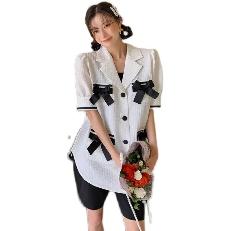 

Bubble sleeve bow splicing white blouse women Xia thin shirt design sense of small business suit collar European high-end goods