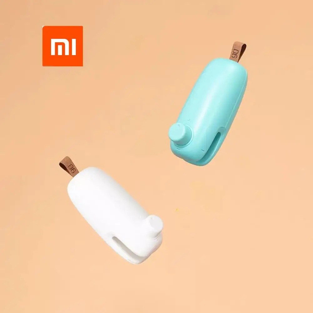 Фото Xiaomi Мини электрическая машина для запечатывания еды скрепки крышки Упаковочная