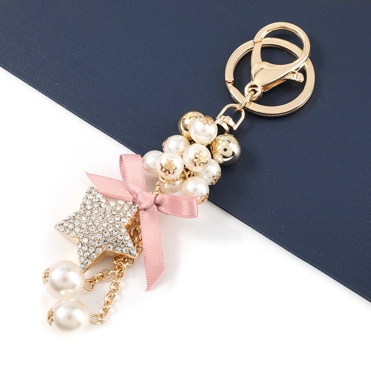 Fashion Metal Rhinestone Five-pointed Star Imitation Pearl Keychain Car Key Ring Girl Backpack Pendant Campus Accessories
Fashion Metal Rhinestone Five-pointed Star Imitation Pearl Keychain Car Key Ring Girl Backpack Pendant Campus Accessories