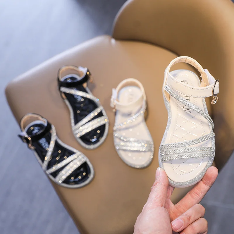 2021 Girls Sandals Summer Shoes Cute Rhinestone Roman Shoes Beige Black Open-Toe Girls Beach Sandals Kids Children Casual Shoes
2021 Girls Sandals Summer Shoes Cute Rhinestone Roman Shoes Beige Black Open-Toe Girls Beach Sandals Kids Children Casual Shoes