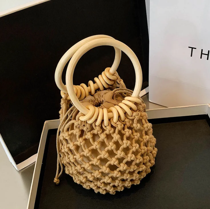 Handmade drawstring straw bag small fresh one-shoulder woven beach bag female bag handbag wooden handleSmall Straw Bucket Bags
Handmade drawstring straw bag small fresh one-shoulder woven beach bag female bag handbag wooden handleSmall Straw Bucket Bags