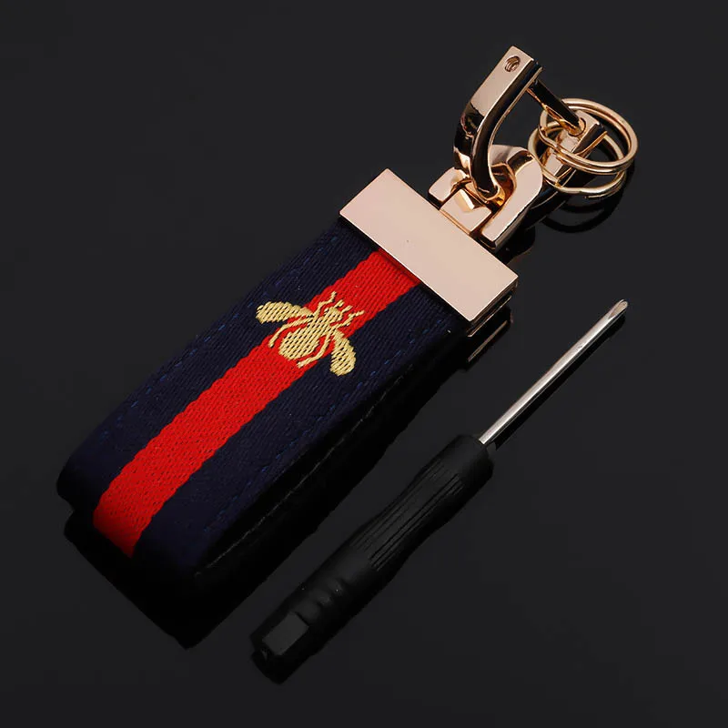 

Little bee keychain three-color webbing leather car keychain high-end key ring chain pendant fashion trend in Europe and America