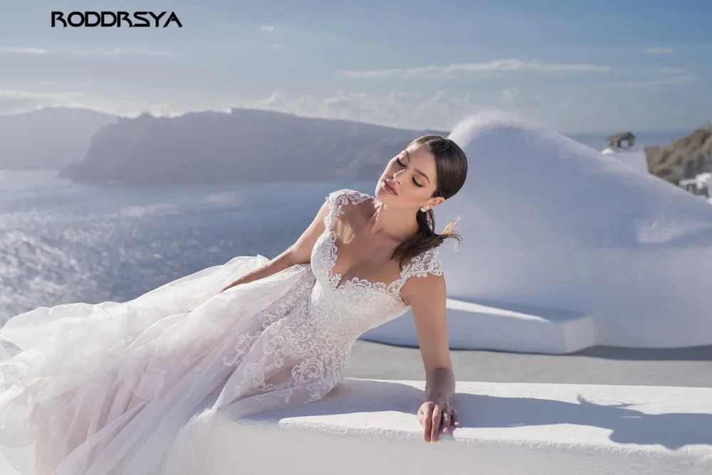 RODDRSYA O Neck A-Line Wedding Dress Illusion Back Cap Sleeves Design Tulle Lace Bride Dresses Princess Dress Tailor-made
RODDRSYA O Neck A-Line Wedding Dress Illusion Back Cap Sleeves Design Tulle Lace Bride Dresses Princess Dress Tailor-made