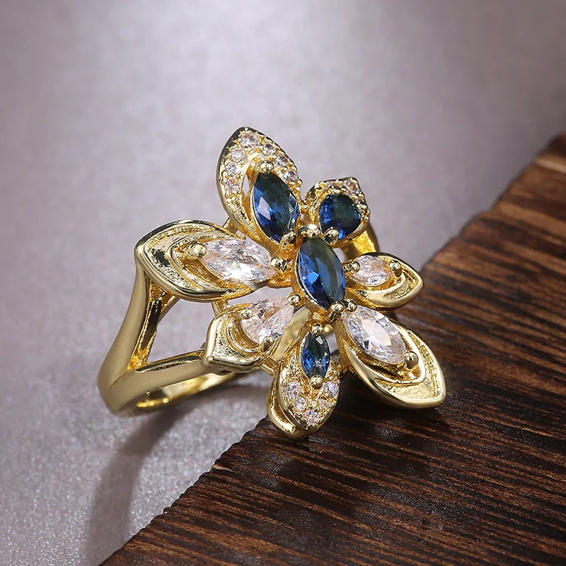Luxury Female Crystal Blue Stone Ring Charm Yellow Gold Color Wedding Rings For Women Cute Promise Flower Engagement Ring 
Luxury Female Crystal Blue Stone Ring Charm Yellow Gold Color Wedding Rings For Women Cute Promise Flower Engagement Ring