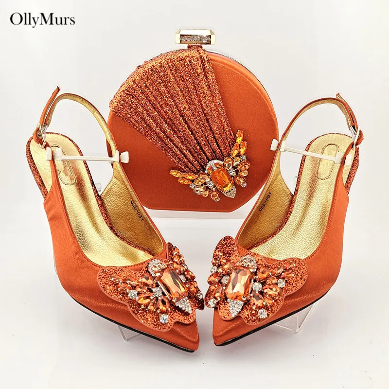 Новое поступление, элегантные туфли и сумки на высоком каблуке 7,5 см, комплект из туфель и сумки в нигерийском стиле для особых вечеринок
Новое поступление, элегантные туфли и сумки на высоком каблуке 7,5 см, комплект из туфель и сумки в нигерийском стиле для особых вечеринок