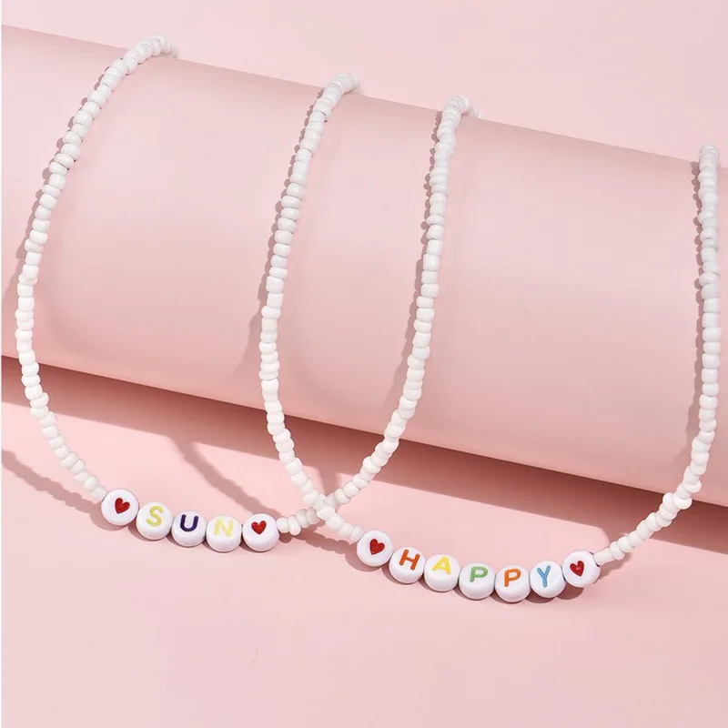 ALYXUY 2Pcs/Set White Color Beads Choker Letters Sun Happy Heart Sweet Short Chain Necklace Fashion Jewelry Women Girls Gift
ALYXUY 2Pcs/Set White Color Beads Choker Letters Sun Happy Heart Sweet Short Chain Necklace Fashion Jewelry Women Girls Gift