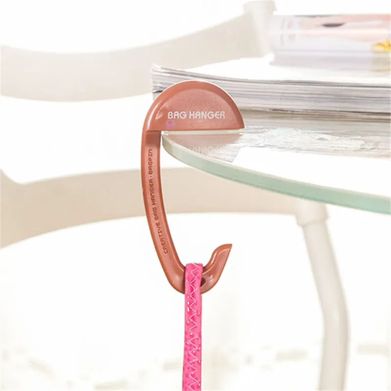 Travel Portable Plastic Bag Hook For Hanging Decorative Table Purse Bag Hooks Wall Hanger Holder Handbag Hanger Decoration
Travel Portable Plastic Bag Hook For Hanging Decorative Table Purse Bag Hooks Wall Hanger Holder Handbag Hanger Decoration