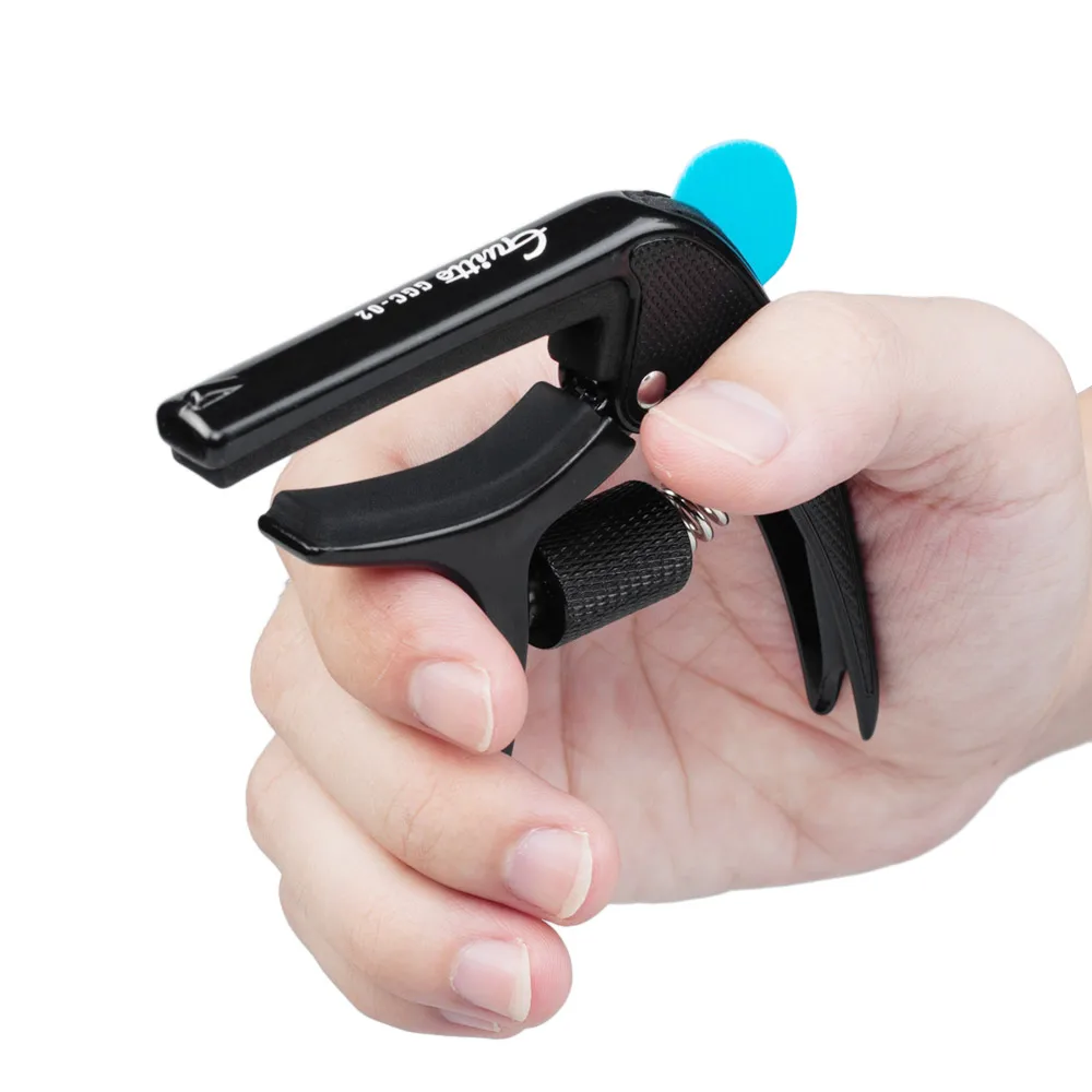 Multifunctional Single-handed Capo Clamp Zinc Alloy with Bridge Pin Puller Guitar Pick for Acoustic Electric Guitars Bass
Multifunctional Single-handed Capo Clamp Zinc Alloy with Bridge Pin Puller Guitar Pick for Acoustic Electric Guitars Bass