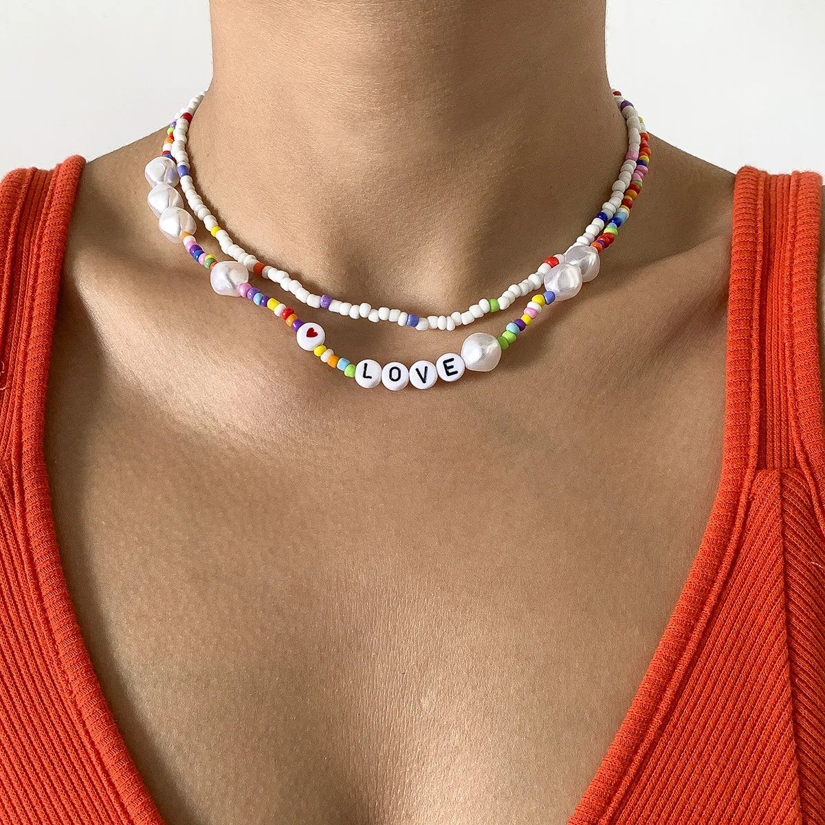 Retro Necklace for Women with Color Stitching Imitation Pearl Clavicle Chain Creative Acrylic Letter Rice Bead Braided Necklace
Retro Necklace for Women with Color Stitching Imitation Pearl Clavicle Chain Creative Acrylic Letter Rice Bead Braided Necklace