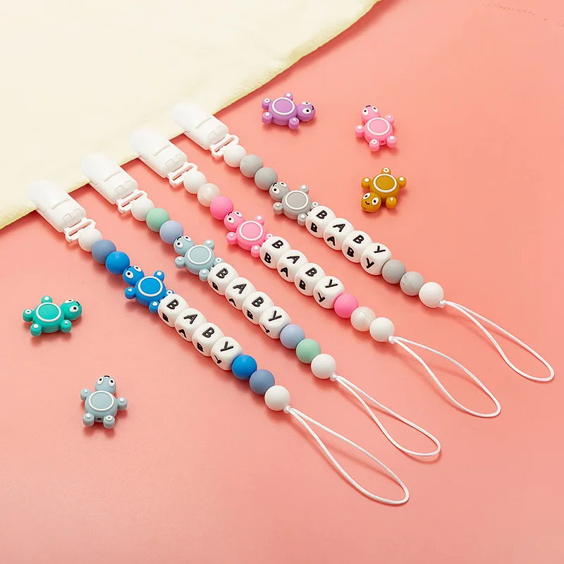 1pcs Silicone Personalised Name Baby Pacifier Clips Crochet Beads Silicone Crown Pacifier Chain Holder Baby Shower Gift TOYS DIY 
1pcs Silicone Personalised Name Baby Pacifier Clips Crochet Beads Silicone Crown Pacifier Chain Holder Baby Shower Gift TOYS DIY
