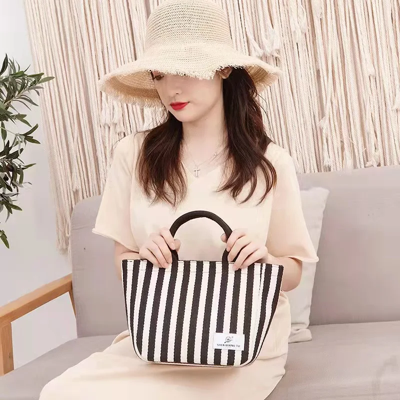 Striped canvas bag women's hand-held casual lady's hand-carrying small bag 2021 new handbag
Striped canvas bag women's hand-held casual lady's hand-carrying small bag 2021 new handbag
