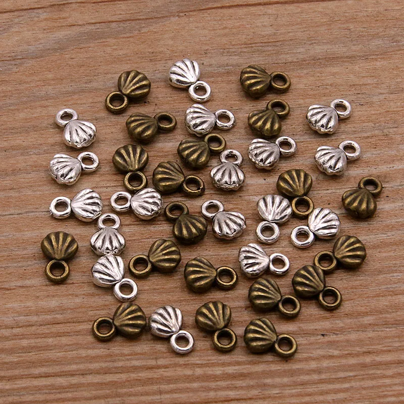 100PCS 6X8mm 2 Color Metal Alloy MINI Double Sided Shell Charms Marine Life Pendants For Jewelry DIY Making Handmade Craft
100PCS 6X8mm 2 Color Metal Alloy MINI Double Sided Shell Charms Marine Life Pendants For Jewelry DIY Making Handmade Craft