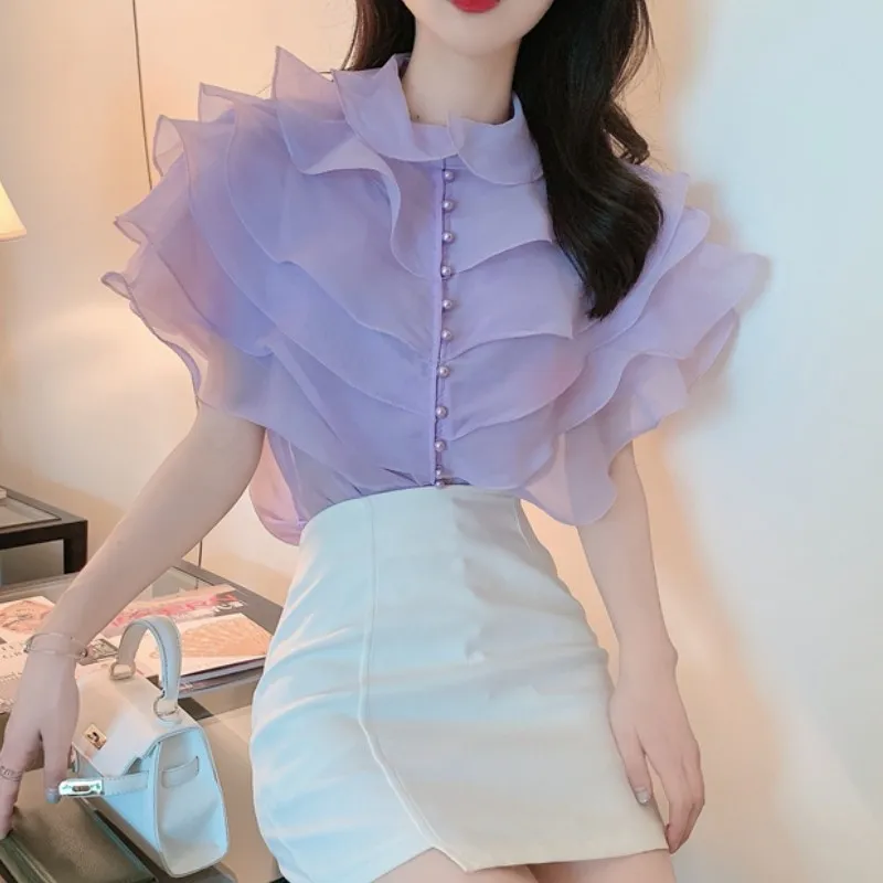 2021 Korea Fashion Elegant Sweet Layered Ruffled Organza Blouses Vintage Pearl Single Breasted Female Shirts Blusas Chic Tops
2021 Korea Fashion Elegant Sweet Layered Ruffled Organza Blouses Vintage Pearl Single Breasted Female Shirts Blusas Chic Tops