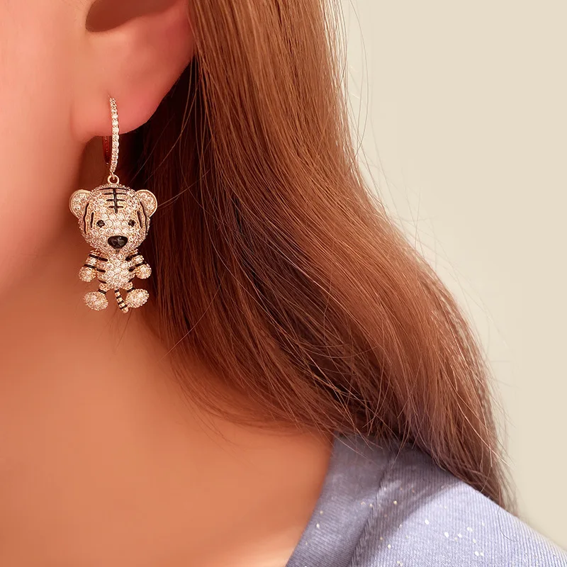 Golden cute tiger earrings studded cartoon animal earring earrings Zodiac tiger pendant female birthday gift
Golden cute tiger earrings studded cartoon animal earring earrings Zodiac tiger pendant female birthday gift