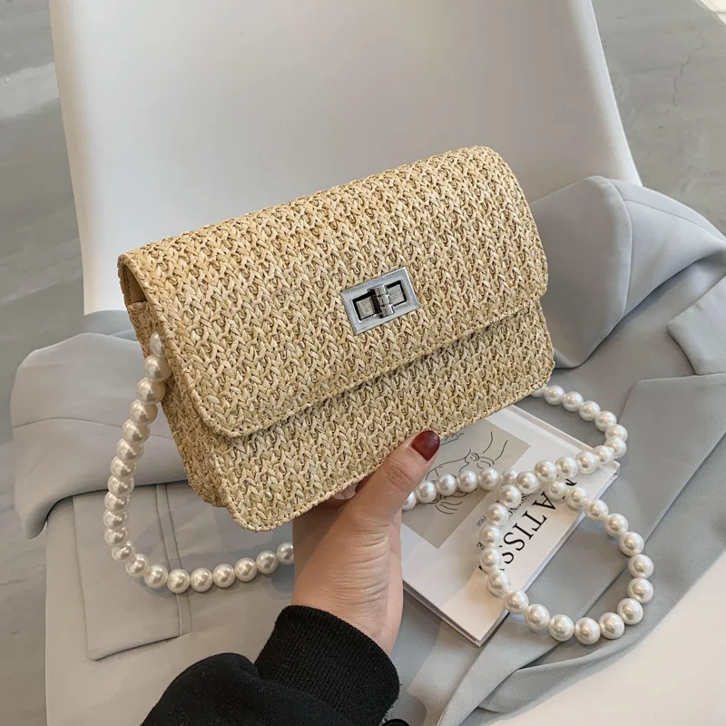 Designer Handbags New Style 2021 Straw Woven Ladies Korean One-shoulder Messenger Bag Fashion Pearl Chain Small Square Bag
Designer Handbags New Style 2021 Straw Woven Ladies Korean One-shoulder Messenger Bag Fashion Pearl Chain Small Square Bag