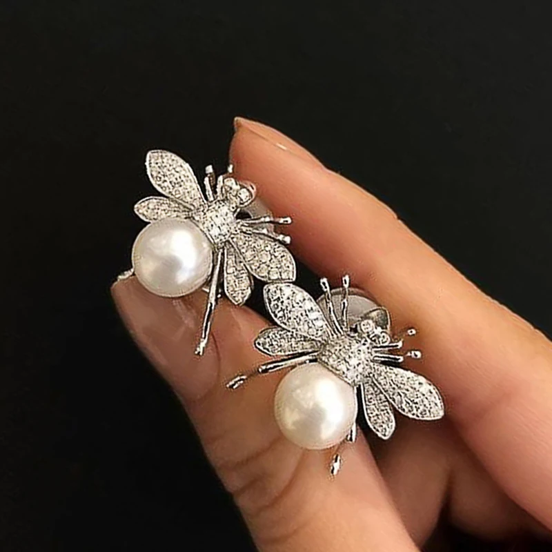 Huitan Fashion Simulated Pearl Bee Stud Earrings Girls with Crystal Cubic Zirconia Cute Animal Earrings Daily Wear Women Jewelry
Huitan Fashion Simulated Pearl Bee Stud Earrings Girls with Crystal Cubic Zirconia Cute Animal Earrings Daily Wear Women Jewelry