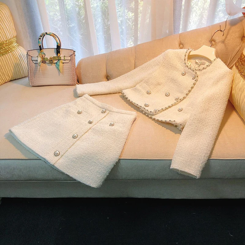 Brand Fashion Women High Luxury Autumn Elegant Ladies Heavy Pearl Tweed White Jackets Coat + Skirt Two-Piece Suit Set
Brand Fashion Women High Luxury Autumn Elegant Ladies Heavy Pearl Tweed White Jackets Coat + Skirt Two-Piece Suit Set