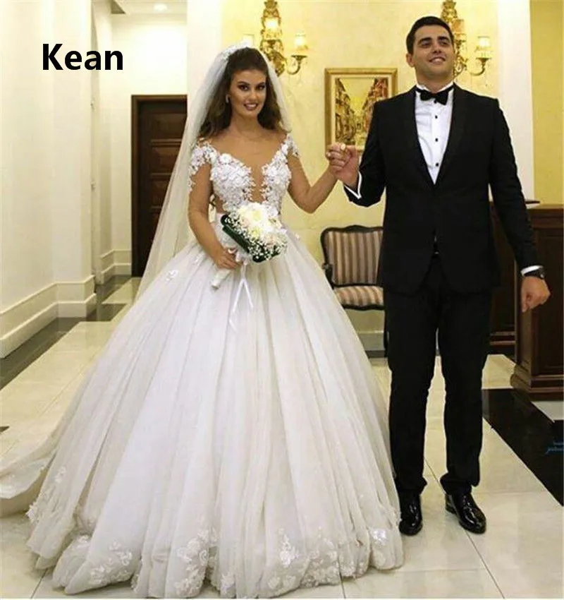 Cap Sleeve Wedding Dress Sexy V-Neck Applique Sweep Train Vestido De Noiva Dubai Arabic Wedding Gown Bride Dress Robe De Mariee
Cap Sleeve Wedding Dress Sexy V-Neck Applique Sweep Train Vestido De Noiva Dubai Arabic Wedding Gown Bride Dress Robe De Mariee
