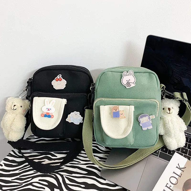 Women cute cartoon small students hit color canvas shoulder bag Korean Girl mobile phone bag
Women cute cartoon small students hit color canvas shoulder bag Korean Girl mobile phone bag