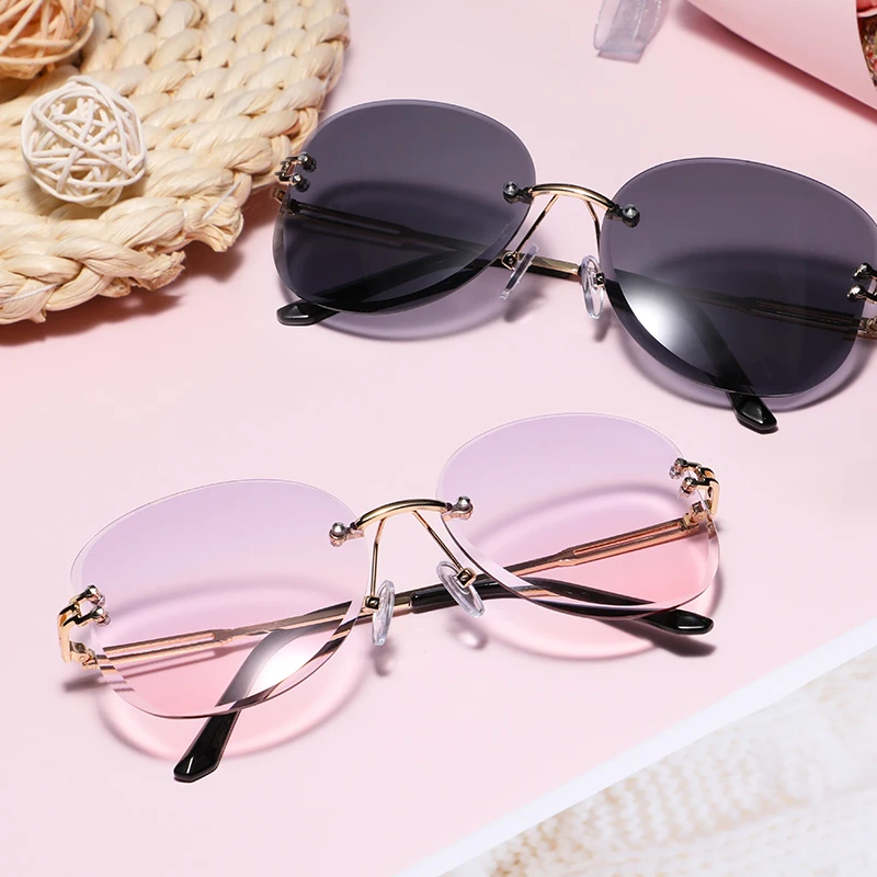 Round Metal Frame Sunglasses Women 2021 Rimless Punk Sun Glasses Gradient Transparent Eyeglasses Trendy Oculos Luxury Sunshdes 
Round Metal Frame Sunglasses Women 2021 Rimless Punk Sun Glasses Gradient Transparent Eyeglasses Trendy Oculos Luxury Sunshdes