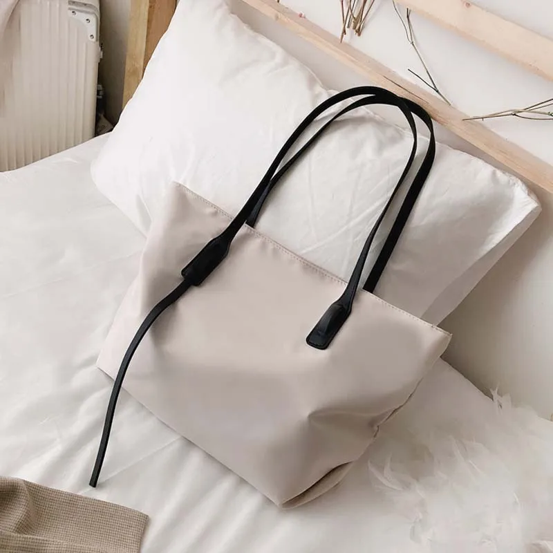 New nylon beach handbag fashion women's handbag Oxford tote tote bag wild commuter single shoulder handbag waterproof
New nylon beach handbag fashion women's handbag Oxford tote tote bag wild commuter single shoulder handbag waterproof