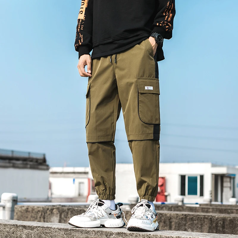 Streetwear Man Jogger Pants Side Pockets Loose Style Men's Sweatpants Fashion 2021 High Street Casual Pants Mens Harem Pants
Streetwear Man Jogger Pants Side Pockets Loose Style Men's Sweatpants Fashion 2021 High Street Casual Pants Mens Harem Pants