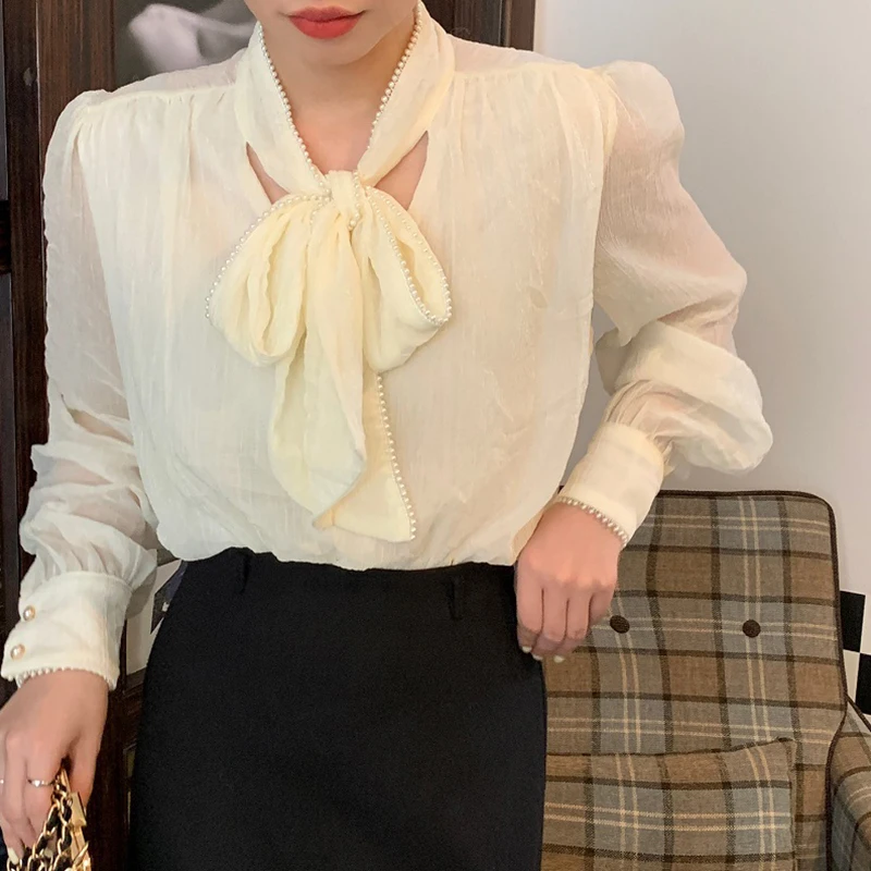 Exquisite Pearl lace frenulum bow thin micro-transparent bubble sleeve Blouses2022 spring and autumn new solid color Joker shirt
Exquisite Pearl lace frenulum bow thin micro-transparent bubble sleeve Blouses2022 spring and autumn new solid color Joker shirt