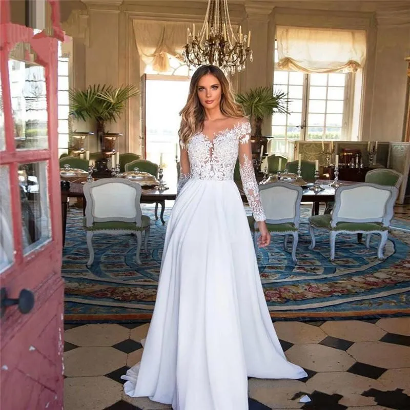 Beach A-Line Wedding Dresses Lace Applique Long Sleeve Sheer Neck Wedding Dress Bridal Gowns Floor Length Vestidos De Noiva
Beach A-Line Wedding Dresses Lace Applique Long Sleeve Sheer Neck Wedding Dress Bridal Gowns Floor Length Vestidos De Noiva