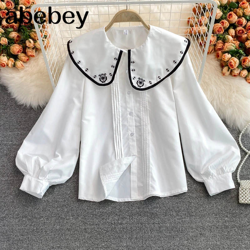 2021 New Spring Autumn Korean doll collar Lantern Sleeve Shirt hit color patchwork embroidery high waist pleated loose Shirt Top
2021 New Spring Autumn Korean doll collar Lantern Sleeve Shirt hit color patchwork embroidery high waist pleated loose Shirt Top