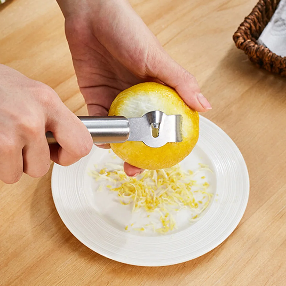 Stainless Steel Lemon Zester Grater Fruit Orange Citrus Peeler Tool for Kitchen Lemon Zester with Channel Knife and Hanging Loop
Stainless Steel Lemon Zester Grater Fruit Orange Citrus Peeler Tool for Kitchen Lemon Zester with Channel Knife and Hanging Loop