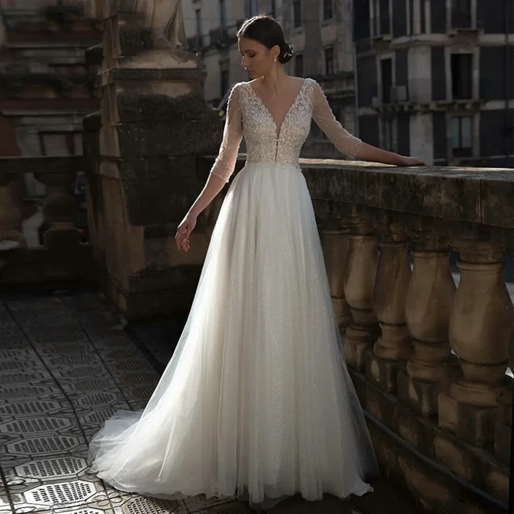 Berylove White A Line Wedding Gown Appliques Beaded V Neck Sexy Pearls Back Wedding Dress Long 2021 New Top Quality Custom Made
Berylove White A Line Wedding Gown Appliques Beaded V Neck Sexy Pearls Back Wedding Dress Long 2021 New Top Quality Custom Made