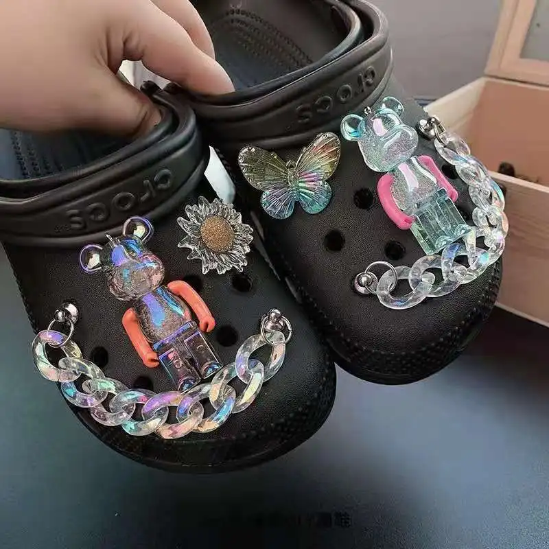 Крутой трехмерный медведь прозрачная толстая цепочка Croc шармы милое солнце бабочка пучок украшение Croc шармы дизайнер
Крутой трехмерный медведь прозрачная толстая цепочка Croc шармы милое солнце бабочка пучок украшение Croc шармы дизайнер