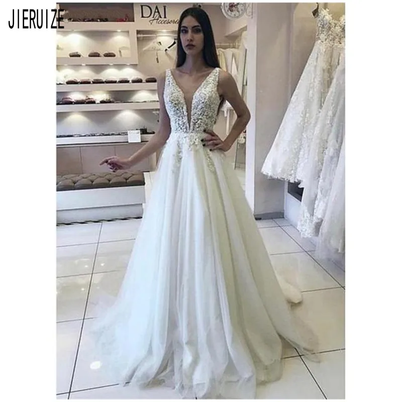 JIERUIZE A-Line Tulle Wedding Dresses V Neck Lace Appliques Sexy Backless Wedding Bridal Gowns Sleeveless Beach robe de mariee
JIERUIZE A-Line Tulle Wedding Dresses V Neck Lace Appliques Sexy Backless Wedding Bridal Gowns Sleeveless Beach robe de mariee