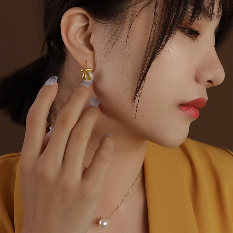 Wholesale Gold Color Bow Knot Drop Earrings With Small Pearl Piercing Jewelry For Women Fashion Stainless Steel Eardrop Pendient
Wholesale Gold Color Bow Knot Drop Earrings With Small Pearl Piercing Jewelry For Women Fashion Stainless Steel Eardrop Pendient