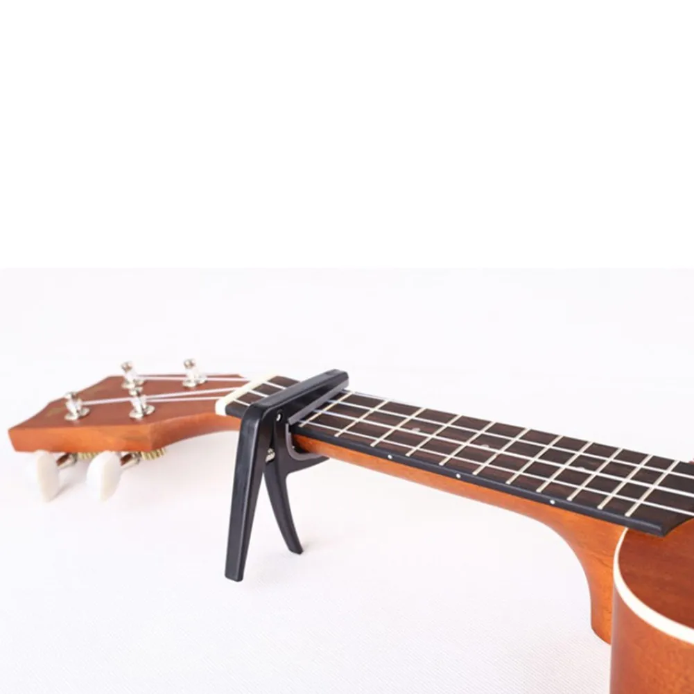 Professional Ukulele Universal Capo 4 String Hawaii Guitar Tuning Clamp Quick Change Key Acoustic Classic Guitar Accessories
Professional Ukulele Universal Capo 4 String Hawaii Guitar Tuning Clamp Quick Change Key Acoustic Classic Guitar Accessories