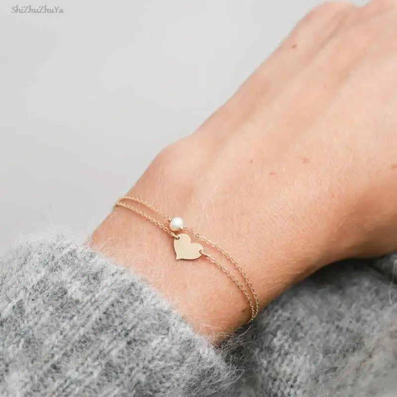 Simple heart-shaped sequins double-layer pendant bracelet sweet design geometric imitation pearl metal chain girl accessory gift
Simple heart-shaped sequins double-layer pendant bracelet sweet design geometric imitation pearl metal chain girl accessory gift