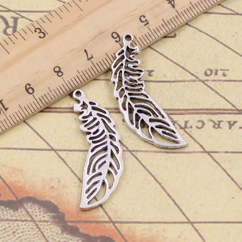 15pcs Charms Hollow Bending Leaf Feather 38x10mm Antique Silver Pendants Making DIY Handmade Tibetan Silver Finding Jewelry 
15pcs Charms Hollow Bending Leaf Feather 38x10mm Antique Silver Pendants Making DIY Handmade Tibetan Silver Finding Jewelry
