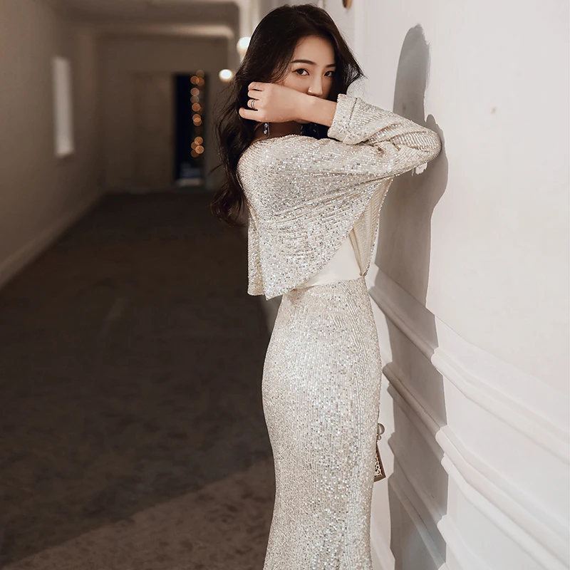 Sexy high-end evening dress female 2021 new luxurious temperament high-quality texture champagne sequin host dress
Sexy high-end evening dress female 2021 new luxurious temperament high-quality texture champagne sequin host dress