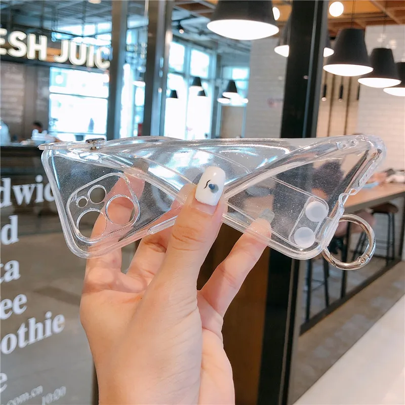 Fluorescence Glitter Holder Phone Case For iPhone 11 X XR XS Max 7 8 Plus Transparent Soft TPU Wrist Strap Shockproof Back Cover 
Fluorescence Glitter Holder Phone Case For iPhone 11 X XR XS Max 7 8 Plus Transparent Soft TPU Wrist Strap Shockproof Back Cover